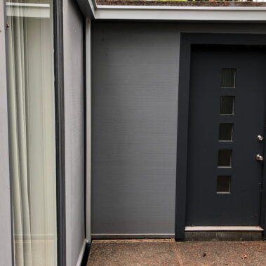 Royal Gutters Portland commercial installation - seamless gutters and modern entryway showcasing property enhancement