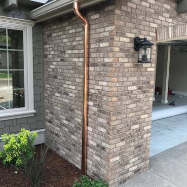 Copper Downspout with White K-Style Gutter