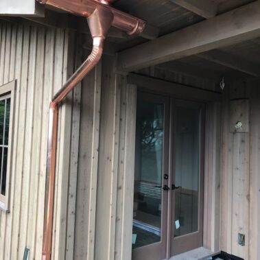 Royal Gutters' premium copper half-round gutter system with custom round downspout installation. Portland's expert solution. 503-558-8700