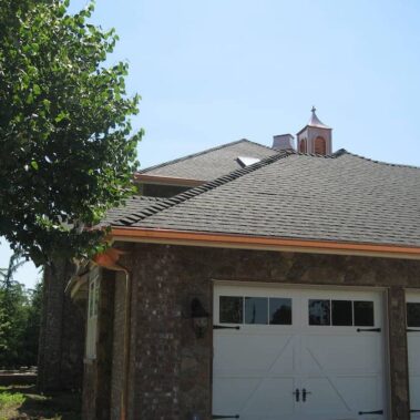 Royal Gutters Portland: Premium Copper K-Style gutter system with matching trim - complete garage view showcasing luxury installation