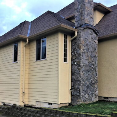 Royal Gutters' professional fascia gutter installation with integrated cleanouts and large outlets. Custom-sized for maximum water flow. 503-558-8700