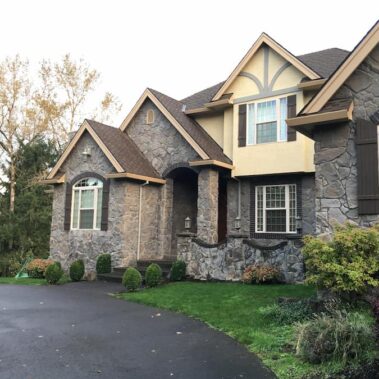 Royal Gutters' premium fascia gutter system expertly installed on luxury Portland stone home. Seamless protection, enhanced curb appeal. 503-558-8700