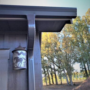 Royal Gutters' premium musket brown fascia gutter with decorative downspout. Custom large outlet design by Portland experts. 503-558-8700