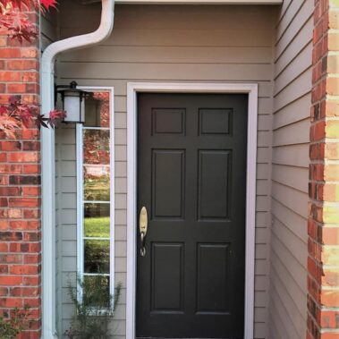Royal Gutters' white fascia gutter with cleanout and curved downspout, professionally installed on Portland home. Fall-ready protection. 503-558-8700