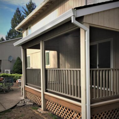 Royal Gutters' white fascia gutter system with square downspouts, professionally installed on Portland porch. Expert craftsmanship. 503-558-8700