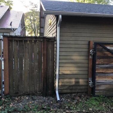 Royal Gutters' galvanized round downspout installation - efficient corner drainage for Portland homes. Expert service: 503-558-8700