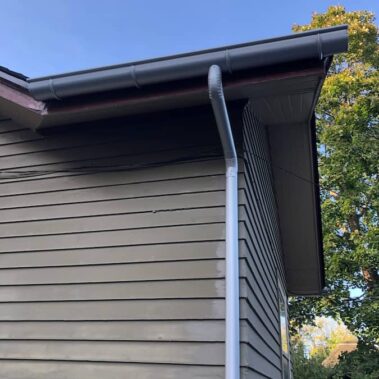 Royal Gutters' black galvanized half-round system with external brackets - expert Portland installation. Call 503-558-8700