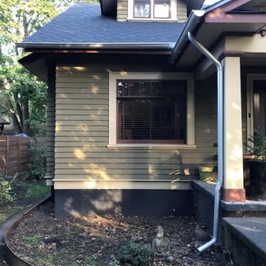 Royal Gutters' galvanized half-round gutter system with round downspout - durable Portland installation. Expert service: 503-558-8700