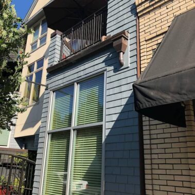 Professional hidden gutter system by Royal Gutters Portland - aged copper installation seamlessly integrated with modern architecture