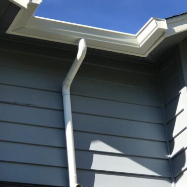 Royal Gutters' round downspout with K-style gutter connection - professional Portland installation for optimal drainage. 503-558-8700