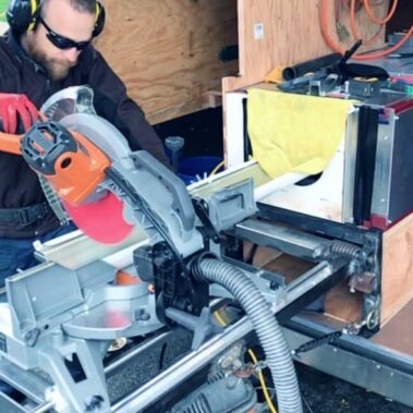 Royal Gutters professional craftsman custom-fabricating gutters in Portland workshop. Safety-first approach. Quality guaranteed. 503-558-8700