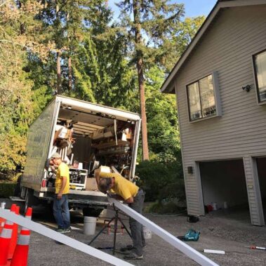 Royal Gutters' professional installation team at work in Portland - expert gutter services with fully-equipped service vehicles. 503-558-8700