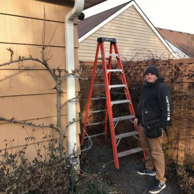 Royal Gutters professional team member performing expert gutter service in Portland. Licensed, bonded, insured. Call 503-558-8700