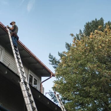 Royal Gutters professional team performing expert gutter installation in Portland. Safe, reliable service by certified technicians. 503-558-8700