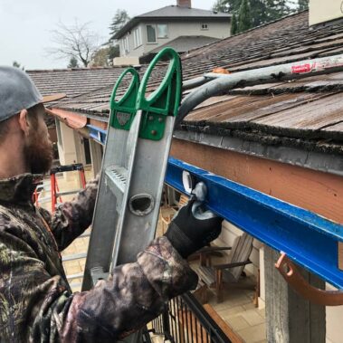 Royal Gutters Portland expert installing premium copper gutters. Professional measurement and precision installation. Call 503-558-8700