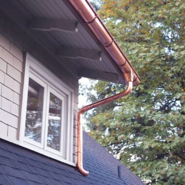 Royal Gutters Portland copper gutter installation - premium system with seamless downspout on residential property, enhancing curb appeal