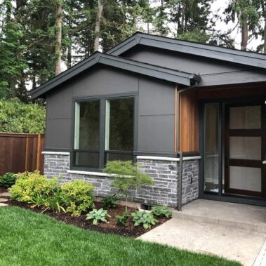 Royal Gutters' smooth square downspout on modern Portland home - sleek design meets efficient drainage. Free estimate: 503-558-8700
