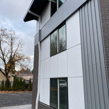 Modern commercial square downspout installation by Royal Gutters Portland - sleek design for contemporary architecture. Call 503-558-8700