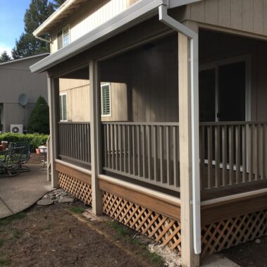 Royal Gutters' professional square downspout installation on covered porch - complete water management for Portland homes. 503-558-8700