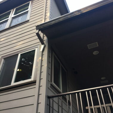 Royal Gutters' smooth square downspout with innovative fascia funnel connection - professional Portland installation. Call 503-558-8700