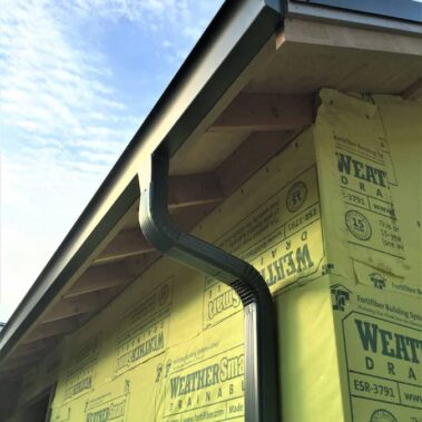 Royal Gutters' Spanish curved gutter with Max Flow outlet system - superior water management for Portland homes. Call 503-558-8700