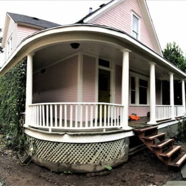 Custom curved K-style gutter installation by Royal Gutters Portland - specialized solution for Victorian home wraparound porch