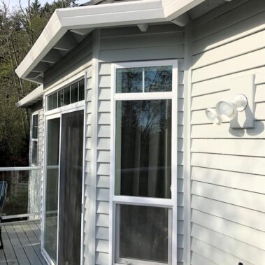 Royal Gutters' seamless white fascia gutter system on Portland home. Professional installation for maximum protection. 503-558-8700