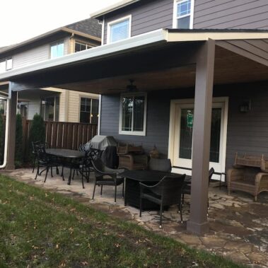Royal Gutters' white fascia gutter system protecting modern Portland patio. Professional installation for outdoor living spaces. 503-558-8700