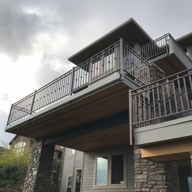 Royal Gutters' wide-bottom deck gutter system, custom-fitted for multi-level Portland patio. Maximum water protection. Free estimate: 503-558-8700